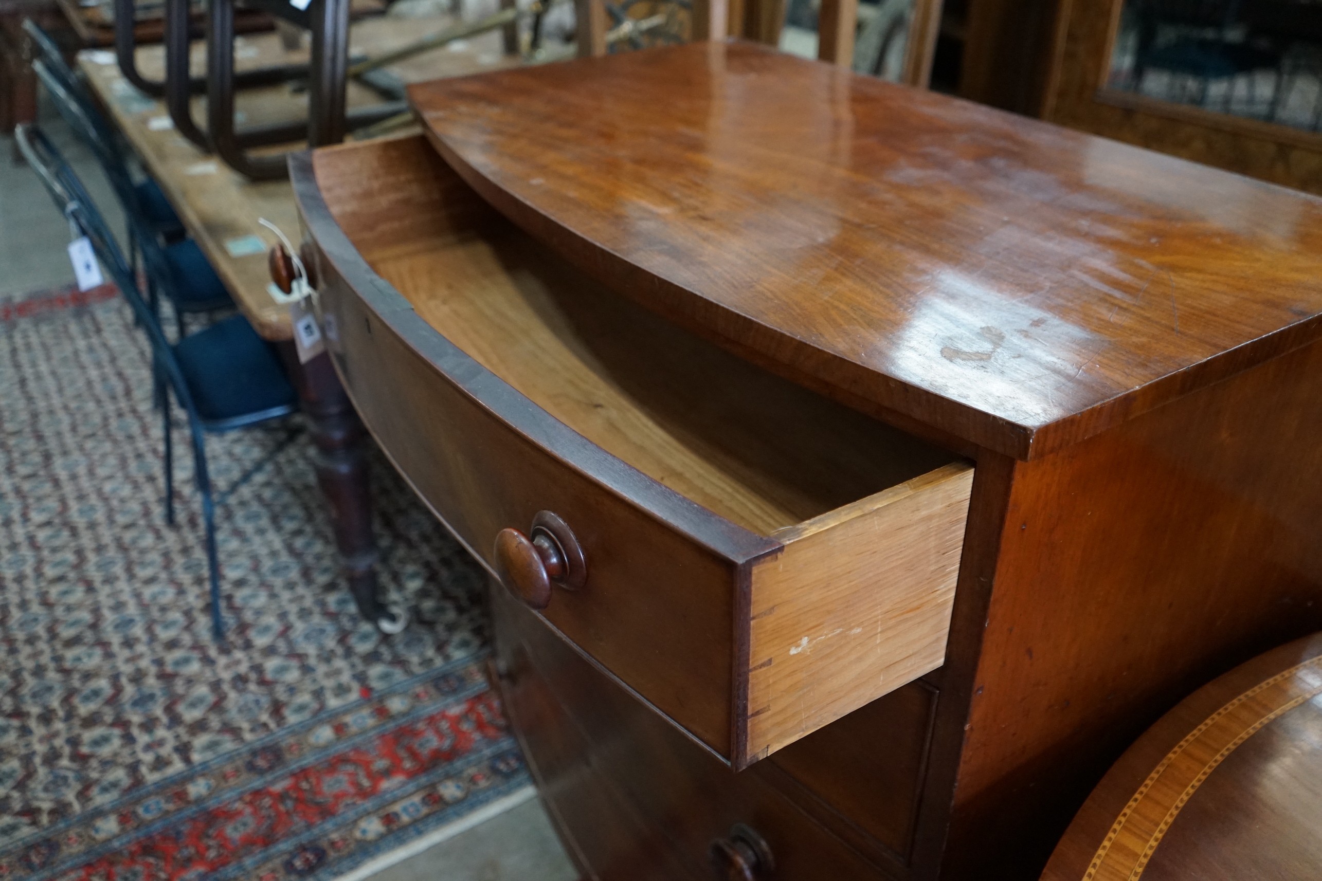 A Regency mahogany bow front chest of four long drawers, width 95cm, depth 54cm, height 106cm